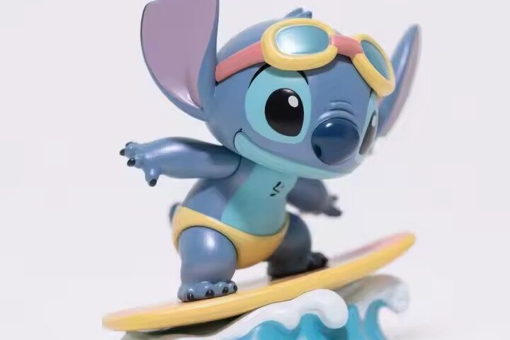 Cute Stitch-inspired cartoon PVC figurine with big ears and blue body for collectible display